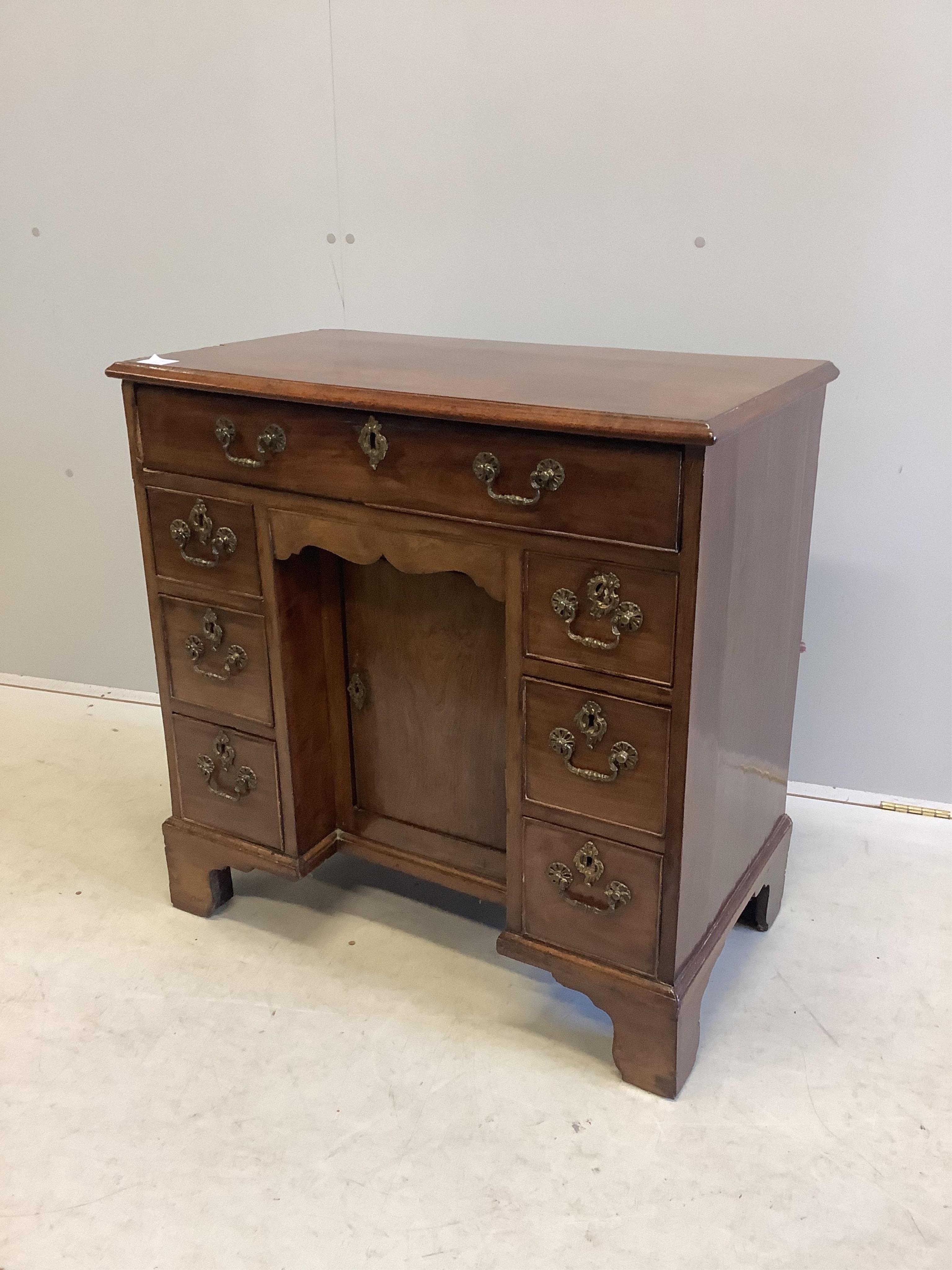 A George III mahogany kneehole desk, width 78cm, depth 43cm, height 78cm. Condition - poor